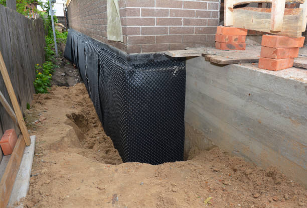 Happy homeowners after waterproofing job in Branchport